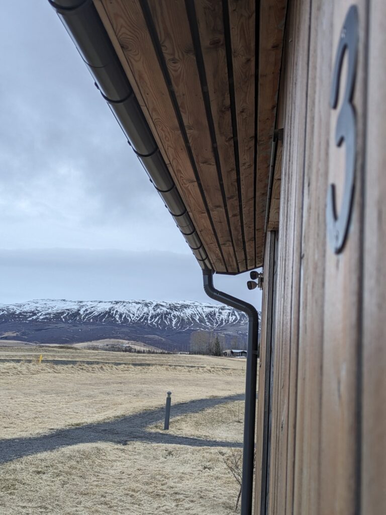 Scenic view of mountains from cabin exterior