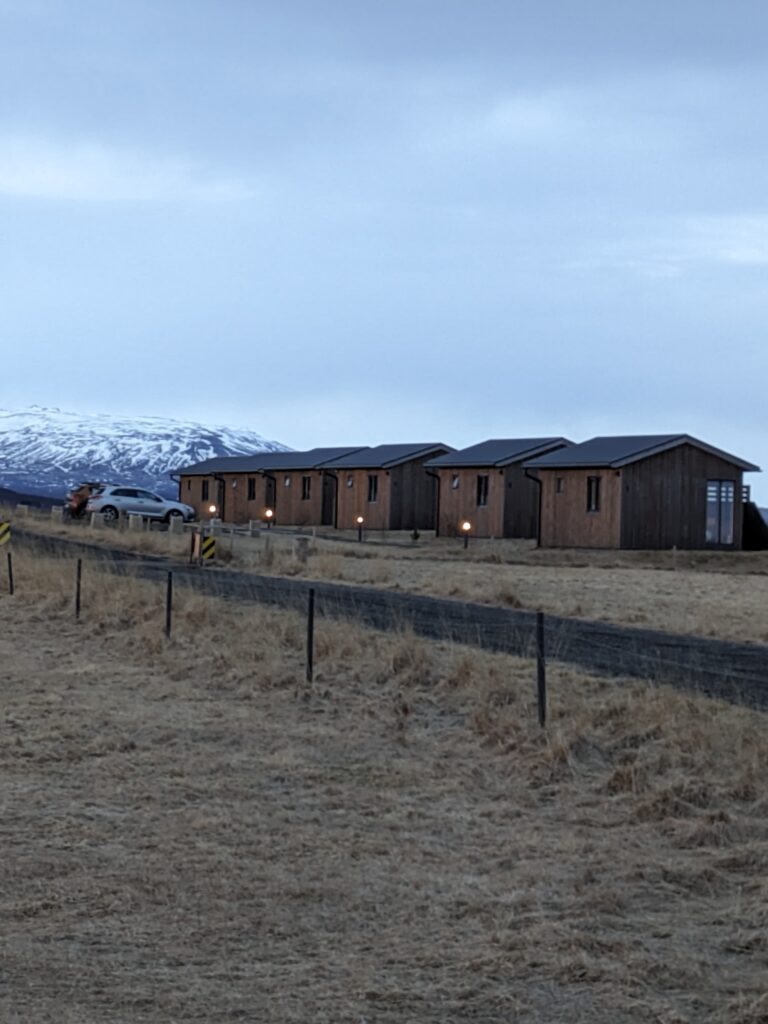 Several cabins lined up in a field