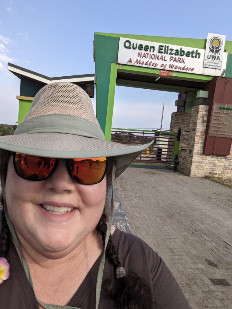 We are entering Queen Elizabeth National Park to start our safari, and I am documenting it with a picture of me. 